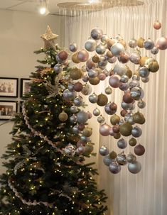 a christmas tree with ornaments hanging from it