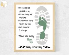 a baby's footprints print with the words happy father's day on it