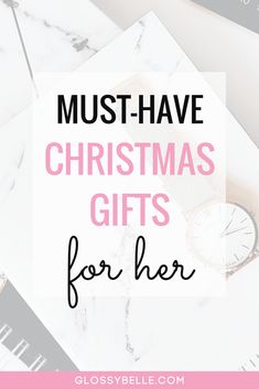 the text must have christmas gifts for her on top of a marble table with watches