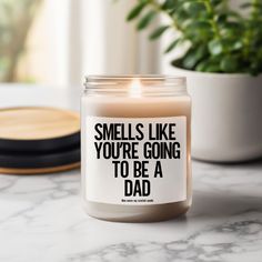 a candle that reads smells like you're going to be a dad