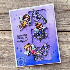 a card with three fairy tinkerbells on it