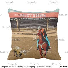 a pillow with a horse and rider on it in the middle of a rodeo arena