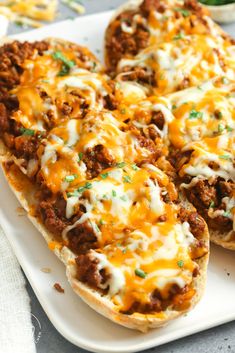 three cheesy stuffed breads on a white plate