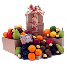 an assortment of fruit and chocolates in boxes