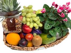 a basket filled with assorted fruits and vegetables