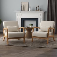 two chairs sitting in front of a fireplace with a table on the floor next to it