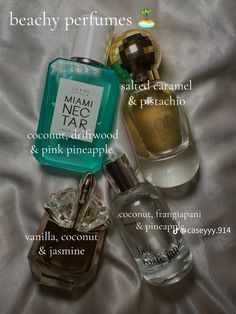 three different perfumes on a bed with the words beauty perfumes written below them