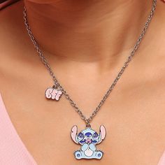 Celebrate friendship with the Disney Stitch & Angel Fashion BFF Necklace Set. This adorable set features pendants of Stitch and Angel, making it perfect for sharing with your best friend. Each piece symbolizes a strong bond and love for the charming characters from Disney's Lilo & Stitch. Bff Necklace, Angel Fashion, Bff Necklaces, Stitch And Angel, Layered Chain Necklace, Cubic Zirconia Necklace, Lilo Stitch, Initial Pendant Necklace, Circle Pendant Necklace