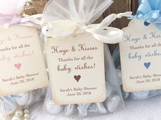 baby shower favors with ribbons and tags on them