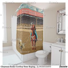 a shower curtain with a horse and rider on it in a bathroom next to a toilet