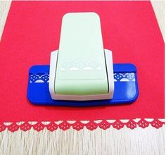 a blue and white object sitting on top of a red mat