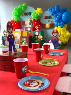 a mario birthday party with red table cloth