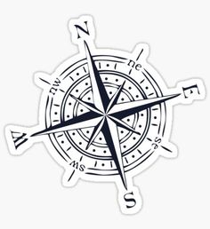 a black and white compass sticker