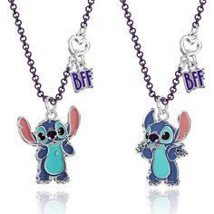 Celebrate the spirit of friendship and ohana with this adorable Stitch necklace set. The set includes two Stitch charm necklaces, each with a matching BFF charm, perfect for you and your best friend. One necklace features Stitch cupping his face, while the other showcases Stitch with his arms out in a shrug, capturing his mischievous and lovable personality. Crafted with faux rhodium-plated metal and enamel coating, these BFF Stitch necklaces are not only cute but also durable. The coated chain Lilo And Stitch Stuff, Lilo And Stitch Doll, Lilo And Stitch Toys, Best Friends Necklaces, Stitch Items, Lilo And Stitch Characters, Matching Bff, Stitch Necklace, Lilo And Stitch Merchandise