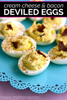 deviled eggs with cream cheese and bacon are on a blue plate