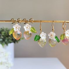 Our cute transparent strawberry earrings are made with glass strawberries, glass leaves, acrylic flowers and 14k gold plated earrings hooks/Bow Tie Studs/Lever Backs which are good for delicate ears. Size: the hook and lever back styles are about 0.6" wide and 1.6" long the bow tie style is about 0.6" wide and 1.4" long Glass Strawberries, Berry Earrings, Birthday Earrings, Yellow Bow Tie, Earrings Food, Strawberry Earrings, Fruit Jewelry, Food Earrings, Fruit Earrings