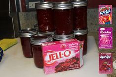 several jars of jello sitting on top of a counter