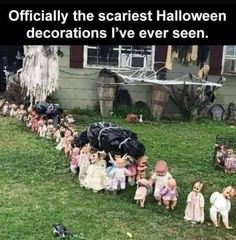 there are many dolls on the lawn in front of a house