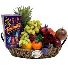 a basket filled with assorted fruit and chocolates