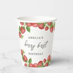 a paper cup with strawberries on it that says, amelia's berry - best birthday