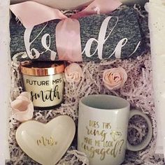 a box filled with coffee mugs and personalized gifts for bridesmaid or groomsmid