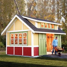 a man standing in front of a small shed