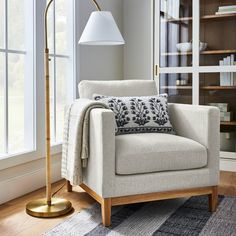 a living room scene with focus on the floor lamp