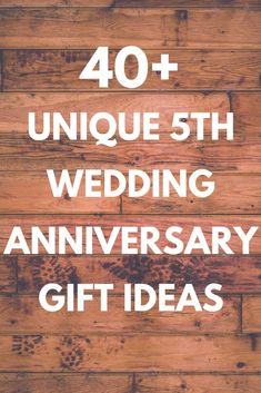 a wooden floor with the words 40 unique wedding anniversary gift ideas in white on it