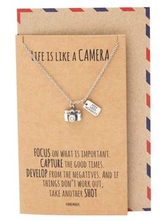 a card with a camera charm on it