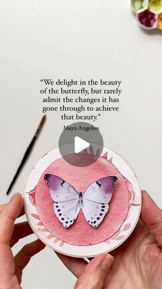 a person holding a paper plate with a butterfly on it and a quote about butterflies