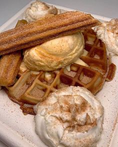 waffles and ice cream on a white plate