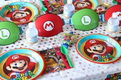 mario birthday party supplies including plates, cups and napkins