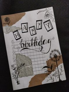 a piece of paper with the words happy birthday written in black and white on it