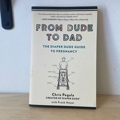 the book from dude to dad is sitting on a table