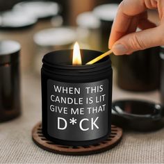 a person lighting a candle with the words, when this candle is lit give me that d c k