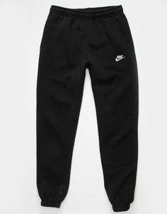 Nike Sportswear Club Fleece Sweatpants. Combines classic style with the soft comfort of fleece. Standard fit has a relaxed, easy feel. Tapered leg. Elastic waistband. Side pockets. Embroidered logo on left leg. Elastic cuffs. Fleece lining. 80% Cotton 20% Polyester. Machine wash. Imported. Nike For Women Clothes, Nike Oversized Sweatpants, Outfit Jogging Nike, Garage Sweatpants, Nike Trackies, Nike Wishlist, Nike Black Joggers, Tuta Nike, Nike Trousers