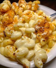 a white plate topped with macaroni and cheese