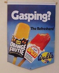 an advertisement for orange fruite pops is hanging on the wall