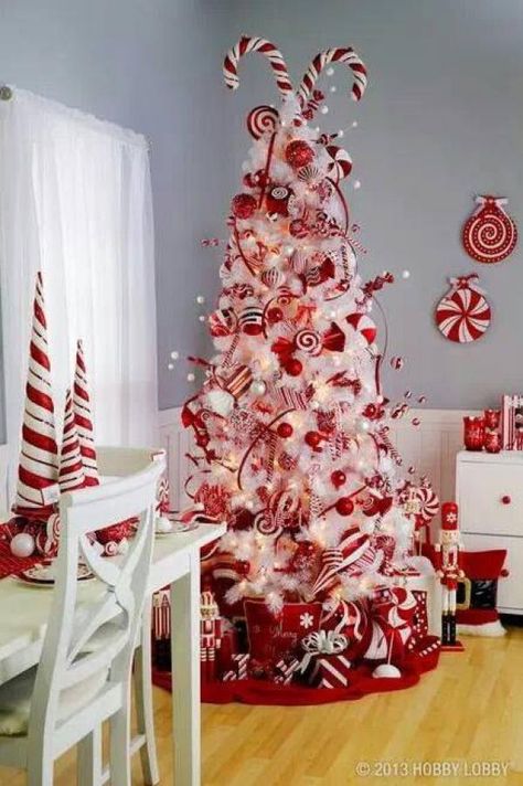 Festive red and white candy cane Christmas tree. Go all out this season with… Red And White Christmas Tree, White Christmas Tree Decorations, Christmas Tree Decorated, Candy Christmas Tree, Pretty Christmas Trees, Candy Cane Christmas Tree, Red And White Christmas, Peppermint Christmas, Red White Christmas