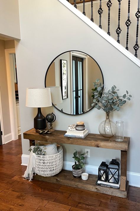 Entryway Console Table Decor -  Thinking of switching this entry up a bit! Before and after coming up. What would you change? #decor #foyer #targetfinds #ltkhome #ltkxwayfair Front Entry Shelf Decor, Entryway Dark Floors, Entryway Ideas Next To Stairs, Home Small Entrance Decor, Flowers For Entryway, Entryway Tables Decor, Farmhouse Modern Entryway Ideas, Entryway Next To Stairs, Home Entryway Decor