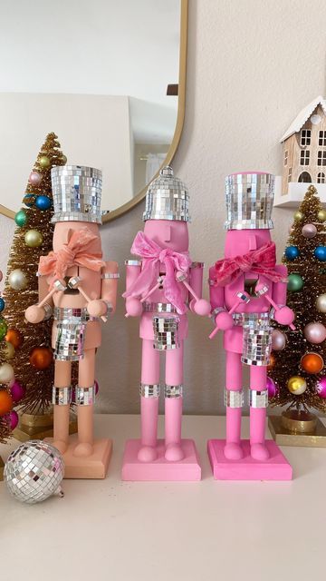 Deborah Trette on Instagram: "diy disco nutcrackers! I picked up wooden craft ones from @michaelsstores, painted with acrylics and attached mirror ball strips! easy but so extra! 💫 make sure to save and share! #diy #diychristmas #christmasdecor #christmascraft #christmasidea #falala #nutcrackers #whimsical #discoball #happyholidays #pinkmas #xmascrafts #makeitwithmichaels #diynutcracker #bhgstylemaker #easydiy #easycraft" Natal, Boho Disco Christmas Tree, Pink Whimsical Christmas, Pinkmas Diy, Pink Disco Christmas Tree, Diy Nutcracker Painting Ideas, Pink Disco Christmas, Disco Nutcracker, Disco Christmas Decor