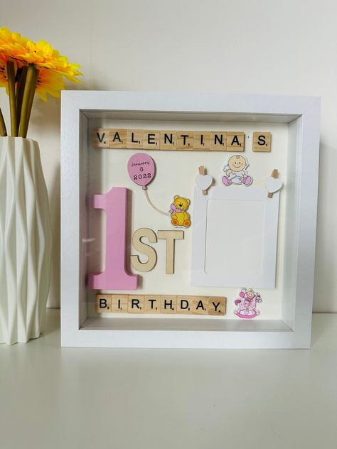 This frame is a beautiful personalized gift for baby's first birthday. Frame Size: 10x10x2 inches (25x25x4.5cm) The little frame inside will fit the photo of approximate size 3.5x2.5 inches or 7x9cm  (the picture might need to be cut down to size). Shadow box frame opens from the back so you can insert your picture. Personalization includes child's name, and optionally date of birth (in short format) that can be placed on the ballon inside of the frame. The frame will only fit one name, so pleas Cricut 1st Birthday Gifts, 1st Birthday Cricut Gift Ideas, 1st Birthday Shadow Box Ideas, Shadow Box Ideas Birthday, 1st Birthday Present Ideas, First Birthday Present Ideas, First Birthday Frame, 1st Birthday Keepsake, Personalised 1st Birthday Gifts