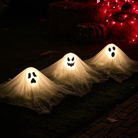 PRICES MAY VARY. Great Value Package: Our package includes 3 pieces of glowing white ghost path stakes, and stakes for fixing the little white ghosts in the ground for outdoor lawn use, the size of the little white ghost is 15inch. Glowing white ghost pathway light stakes turn your outdoor space into a creepy spectacle, creating a frightening atmosphere for Halloween night. Eye-Catching Design: Each stake features a white ghost yard stake and can light up, adding an eerie glow to your lawn or ga Halloween Ghost Decorations, Lights Decor, Haunted House Decorations, Haunted House Party, Decoration Lights, Adornos Halloween, White Ghost, Halloween Garden, Fun Halloween Decor