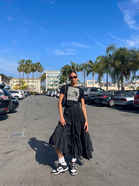 Long Skirt Outfits Graphic Tee, Graphic Tee Black Skirt Outfits, Black Skirt And Graphic Tee Outfit, T Shirt With Flowy Skirt, Dunk Low With Dress, Pleated Skirt Outfit Street Style, Black Layered Skirt Outfit, Boho Black Skirt Outfit, Panda Inspired Outfit