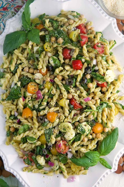 Easy Pesto Pasta Salad is the perfect dish for picnics, or a light lunch. This vibrant salad combines pasta, juicy tomatoes and basil pesto. Basil Side Dish Recipes, Essen, Easy Pesto Meals, Pasta Salad Summer Cold, Pesto Pasta Salad Vegetarian, Spinach Pesto Pasta Salad, Healthy Antipasto Salad, Pasta Salad With Olive Oil Dressing, Recipes With Basil Pesto Sauce