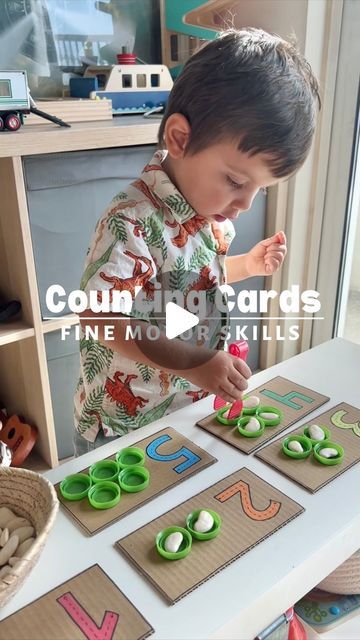 Stephanie & Katrina | Crafty Moms on Instagram: "If you have a toddler at home, you need to try this activity! It’s incredibly simple to set up (no artistic skills needed), and you likely already have everything you need. This game is fantastic for teaching your toddler numbers and counting skills while also improving fine motor skills as they strengthen their little hand muscles trying to pick up lima beans with tweezers.

Our child had a blast with this game, and we hope yours will too! Save this post for later or share it with someone who would love it!

❌ Please do not share this video on your feed. (Stories and DMs are fine)
.
.
.
.
.
.
.
.
.
.
#earlychildhoodeducation #playlearningideas #playlearngrow #kidsactivities #activitiesforkids #montessoriathome #montessoritoddler #waldorf #h Preschool Hand Strengthening Activities, Toddler Hands On Activities, Threading Activities For Toddlers, Teaching Toddlers Numbers, Preschool Manipulative Activities, Fine Motor Activities For Toddlers Ideas, Number 2 Activities For Toddlers, Yoga Crafts For Kids, Manipulatives For Toddlers