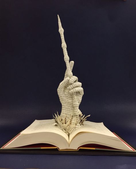 Amazing book sculpture, perfect for the Potterhead in your life Altered Book Art, Book Project Ideas, Book Art Sculptures, Elder Wand, Folded Book Art, Book Sculpture, Book Folding, Book Projects, Open Book