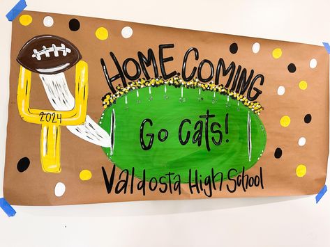 Homecoming sign, football homecoming, homecoming 2024, painted banner, painted sign, brown paper sign homecoming, football banner, football party banner, first year down banner  Please include the following in the personalization details: Wording school colors  etc  THIS LISTING IS ONLY FOR A HAND PAINTED BANNER. No balloons or other accessories will be included.  I will email a digital mock-up of your banner for final proof before I begin painting. Please send a message for rush order requests Neon Run Through Signs Football, Homecoming Banners High School, Superhero Theme Football Game, Homecoming Posters School Spirit, Beat The Bulldogs Football Signs, School Homecoming Decorations, Football Fence Signs, Homecoming Football Banner Ideas, School Spirit Window Painting