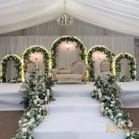 Absolutely loved creating this stunning wedding decor! 🤍 Swipe to see one of our favorite setups yet. #WeddingDecor #EventStyling Decor: @rococo.events Venue: @keythorpemanor #weddingdecorators #weddingdecorinspiration #eventdecorators #floraldecoration #weddinginsporation #ukweddingplanners #floralwedding white, green, gold, wedding theme, staging, archway, floral arch, table decor Green Flowers Wedding Decor, White Theme Wedding Receptions, Green And White Wedding Stage Decor, White And Green Themed Wedding, Unique Reception Decor, White And Green Wedding Decor Reception Ideas, Green And White Decor Wedding, Wedding Decor Green And White, Floral Wedding Decorations Receptions