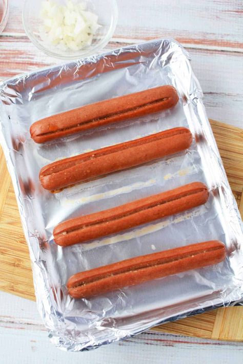 Sheet pan hot dogs in the oven frozen or fresh. Easy way to make lunch in bulk quickly! Roasted plump Oscar Mayer or Hebrew National wieners. Oven Hot Dogs Baking, Cook Hot Dogs In Oven, How To Cook Hotdogs In The Oven, Roasted Hot Dogs In The Oven, Bake Hotdogs In Oven, How Long To Bake Hot Dogs In The Oven, Oven Roasted Hot Dogs, Cooking Hot Dogs In Oven, Hot Dog In Oven